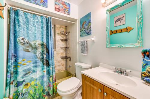 a bathroom with a fish shower curtain and a sink at Pet-Friendly Bradenton Home 1.5 Mi to Cortez Beach in Bradenton