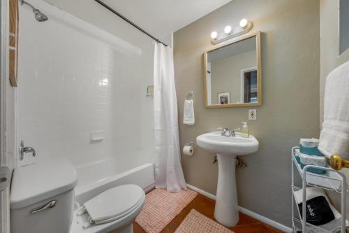 a bathroom with a toilet and a sink and a mirror at Santa Rita Primary (Mike Morgan) in Tucson