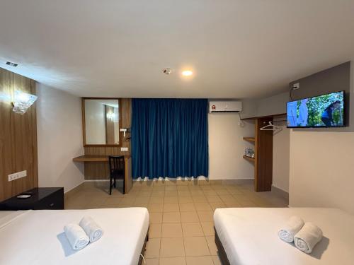 Μια τηλεόραση ή/και κέντρο ψυχαγωγίας στο Hotel Putra Hills