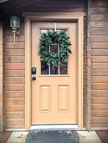 a door of a house with a wreath on it at Sq Bayside Cedars in Sequim