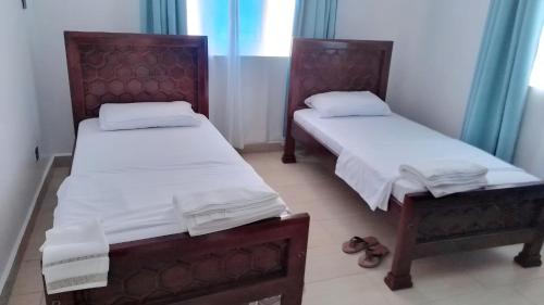 Postel nebo postele na pokoji v ubytování Seasalt & Sand