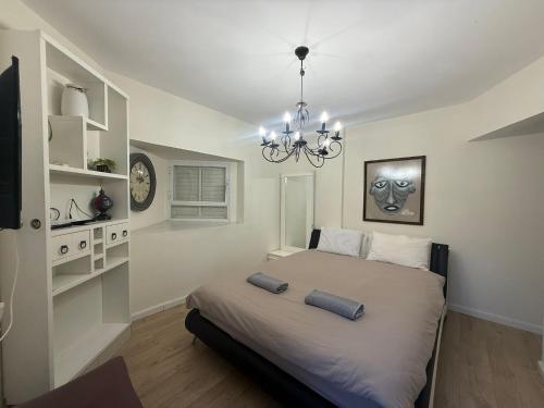 a bedroom with a bed with two pillows on it at Las Palmas in Eilat