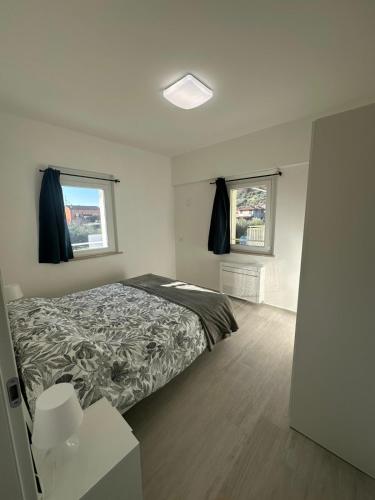 Postel nebo postele na pokoji v ubytování Appartamento Cataleya