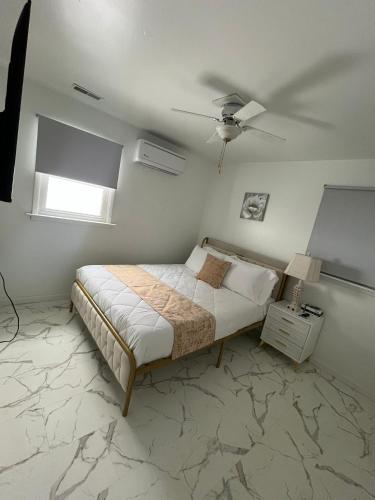 a bedroom with a bed and a ceiling fan at CampRV Main Lodge in Elkins