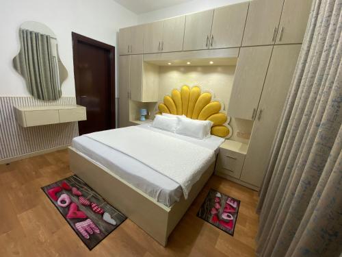 a bedroom with a bed with a bunch of bananas on it at Cheap Holiday Home in Ajman