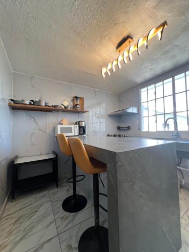 Køkken eller tekøkken på Villa Napoli Apartment Suites