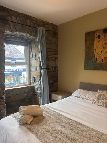 En eller flere senge i et værelse på The Nest on The Octagon