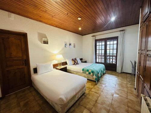 En eller flere senge i et værelse på Geres Mountain View Guest House