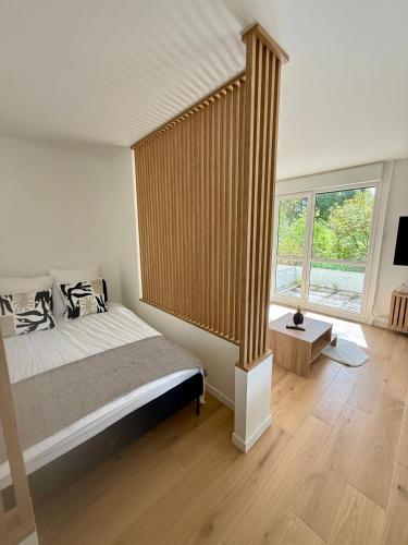 Giường trong phòng chung tại Appartement neuf avec parking