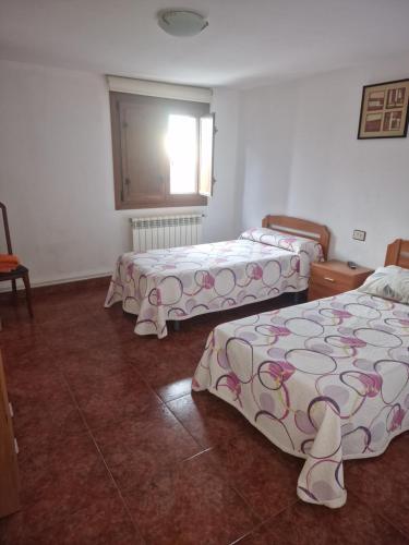 Postel nebo postele na pokoji v ubytování Fogar do Gabino