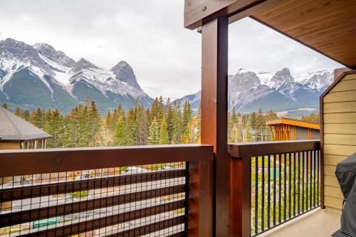 a balcony with a view of mountains at Rundle Range Retreat Lux Mtn View Condo near dt in Canmore