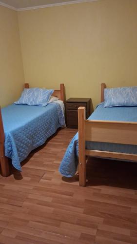 Giường trong phòng chung tại Hostal Nancy