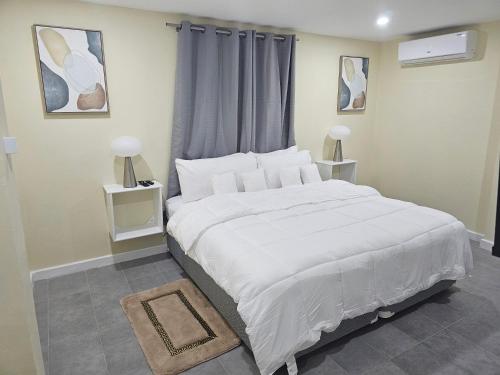 En eller flere senge i et værelse på Belle Vue Comforts