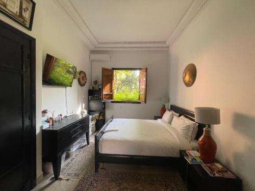 Giường trong phòng chung tại Riad WAEL