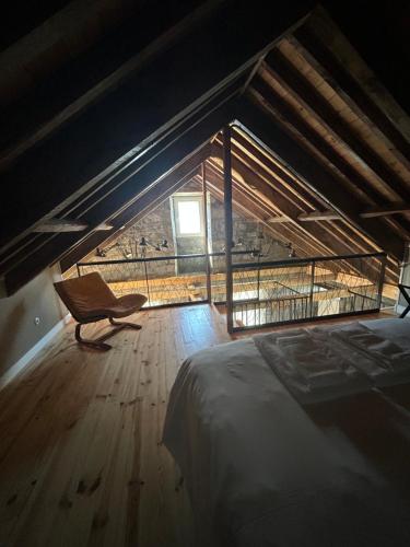 En eller flere senge i et værelse på Cá Por Casa Pico-Vinhático