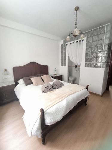 Giường trong phòng chung tại Julia Home, habitaciones en casa de un particular