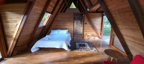 En eller flere senge i et værelse på Chalet MA