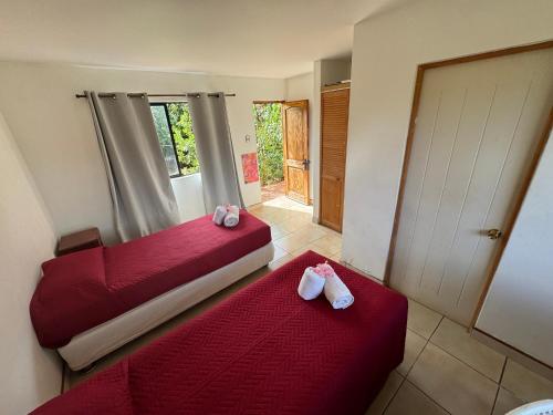 Un pat sau paturi într-o cameră la Cabañas Refugio Arqueologico