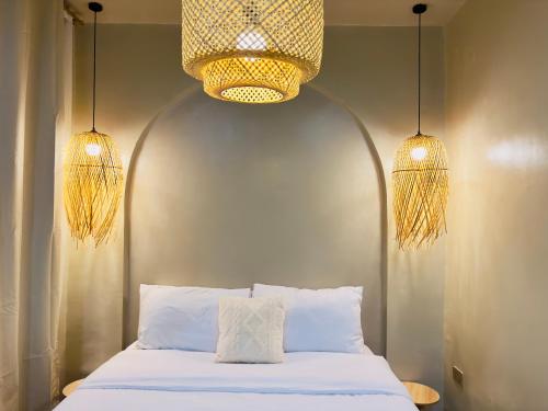 En eller flere senge i et værelse på Arko Villa