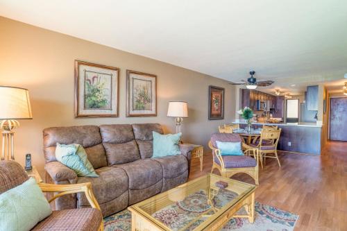 a living room with a couch and a table at Lauloa 102 in Wailuku