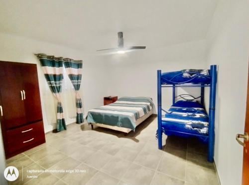 Postel nebo postele na pokoji v ubytování Departamentos Don Luis