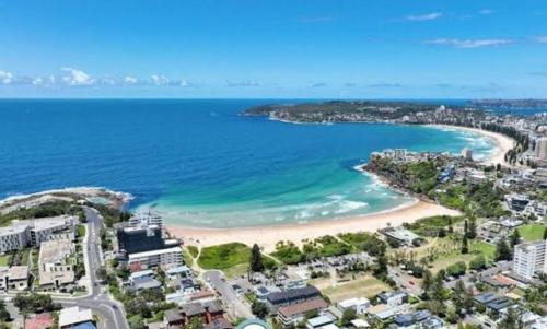 an aerial view of a beach and the ocean at Freshwater Coastal Retreat 3BR Apartment in Freshwater