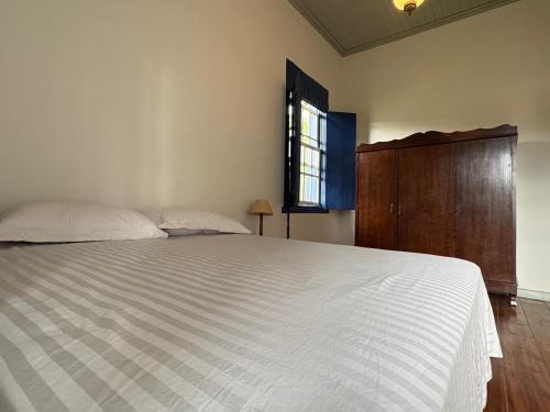 En eller flere senge i et værelse på Casa de Campo- Fazenda