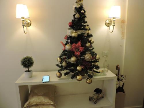 a christmas tree on a table in a room at A & E Buenos Aires in Buenos Aires