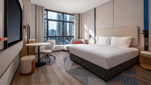 En eller flere senge i et værelse på Holiday Inn Express Chengdu Phoenix Mountain by IHG