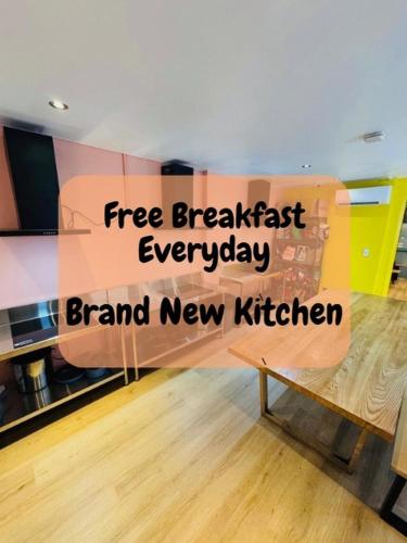 a sign that reads free breakfast everyday brand new kitchen at The Social Hotel, Sydney in Sydney