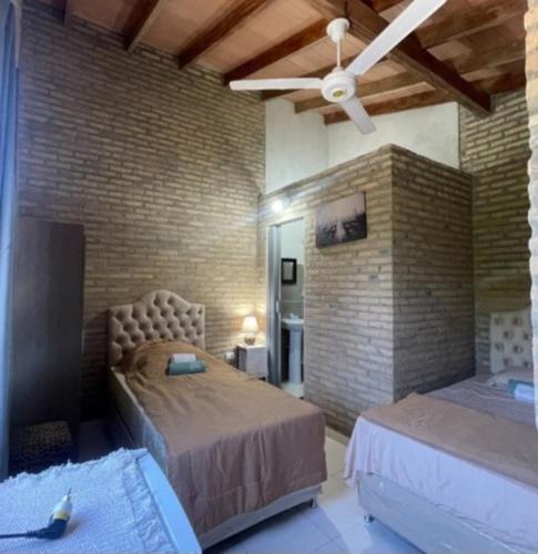 Postel nebo postele na pokoji v ubytování Villa Fernandito