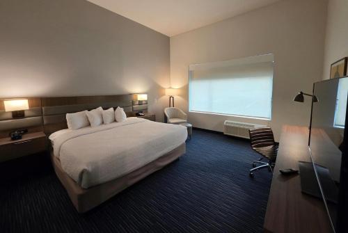 Ένα ή περισσότερα κρεβάτια σε δωμάτιο στο Hawthorn Extended Stay Austin North