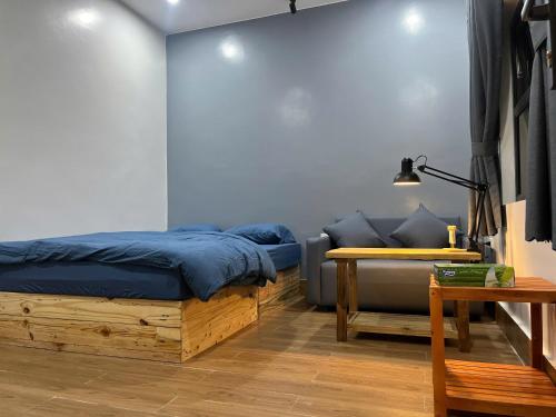 Giường trong phòng chung tại Shang Hotel