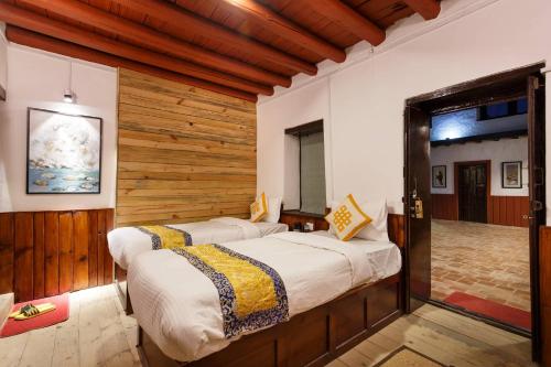 Postel nebo postele na pokoji v ubytování Hotel Oms Home