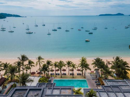 an aerial view of the beach and boats at Bandara Pool Villas, Phuket in Panwa Beach