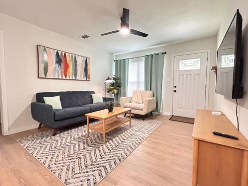 a living room with a couch and a table at Cozy Modern 3BR Escape - Sanford in Sanford