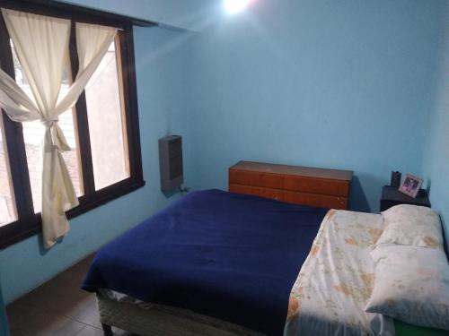 En eller flere senge i et værelse på Chalet con Cochera techada