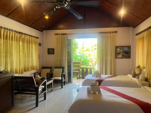 Postel nebo postele na pokoji v ubytování The Green Oasis Resort