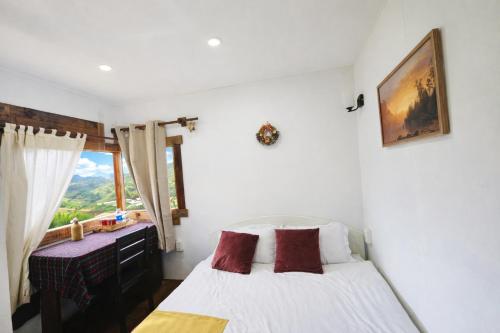 Postel nebo postele na pokoji v ubytování NOMAD Home & Coffee