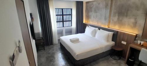 Postel nebo postele na pokoji v ubytování Muari Boutique Hotel