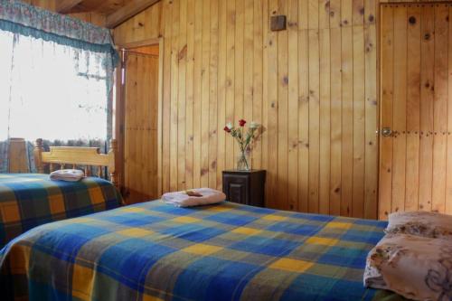 Postel nebo postele na pokoji v ubytování Centro de Aclimatizacion La Casa de Simon Lodge