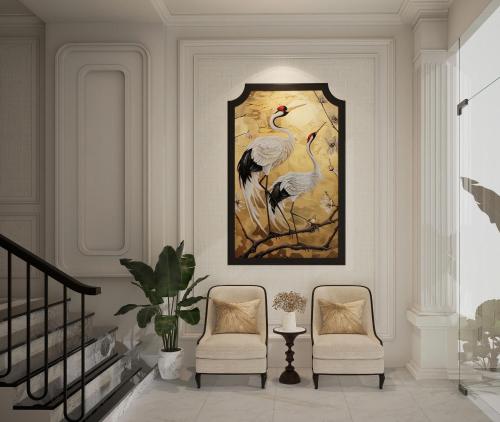 a living room with two chairs and a painting of birds at Light Vesper Premium Hotel & Sky Bar in Ho Chi Minh City