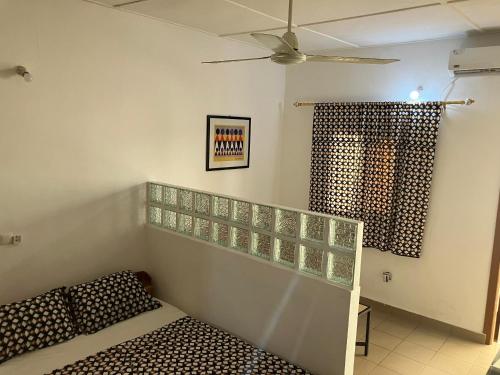 Giường trong phòng chung tại Résidence Agbevivi