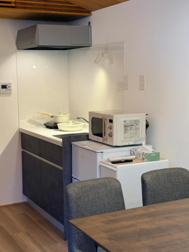 Kuchyň nebo kuchyňský kout v ubytování 雪箱神楽