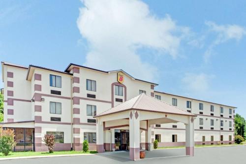 a hotel with a gazebo in front of it at Super 8 by Wyndham Jackson Ridgeland in Jackson