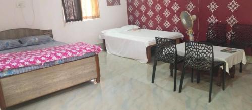 Una cama o camas en una habitación de Shobuj Kutir সবুজ কুটির