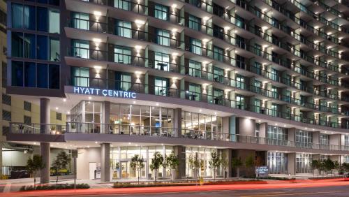 an exterior view of a hotel building at night at Hyatt Centric Brickell Miami in Miami
