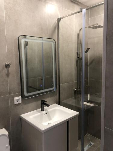 a bathroom with a sink and a shower at Miassine Boutique Hotel in Gyumri