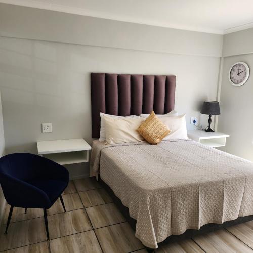 En eller flere senge i et værelse på No 4 Bayview Manor