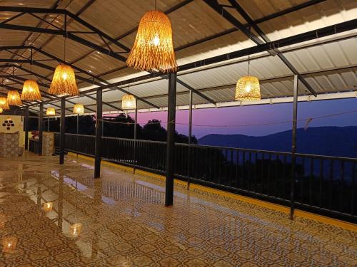 a row of lights hanging from the ceiling of a building at The SKYi County Dapoli in Dapoli